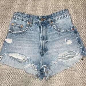 Zara women high waisted ripped jeans shorts in size zero.
